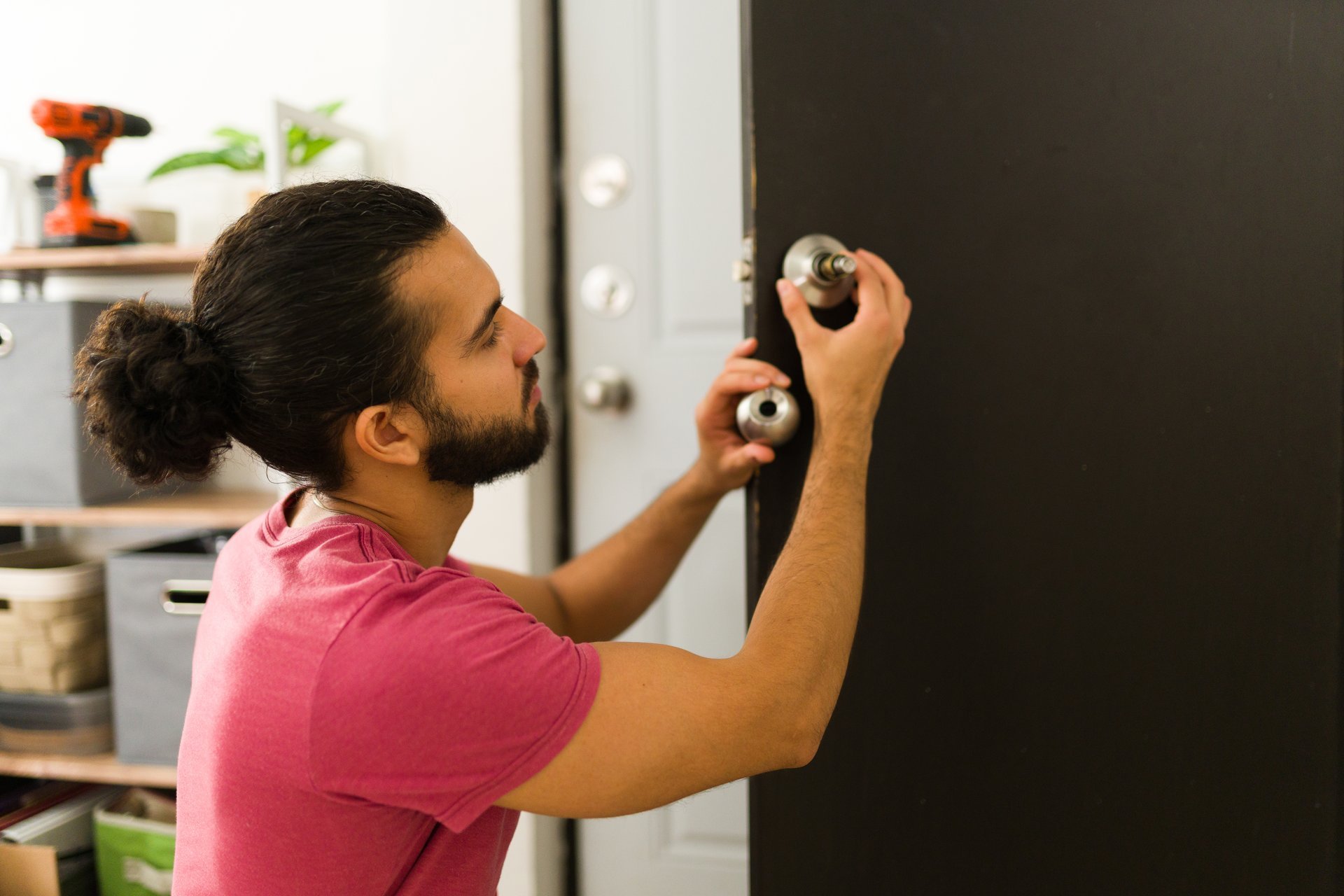 Professional locksmith securing a home